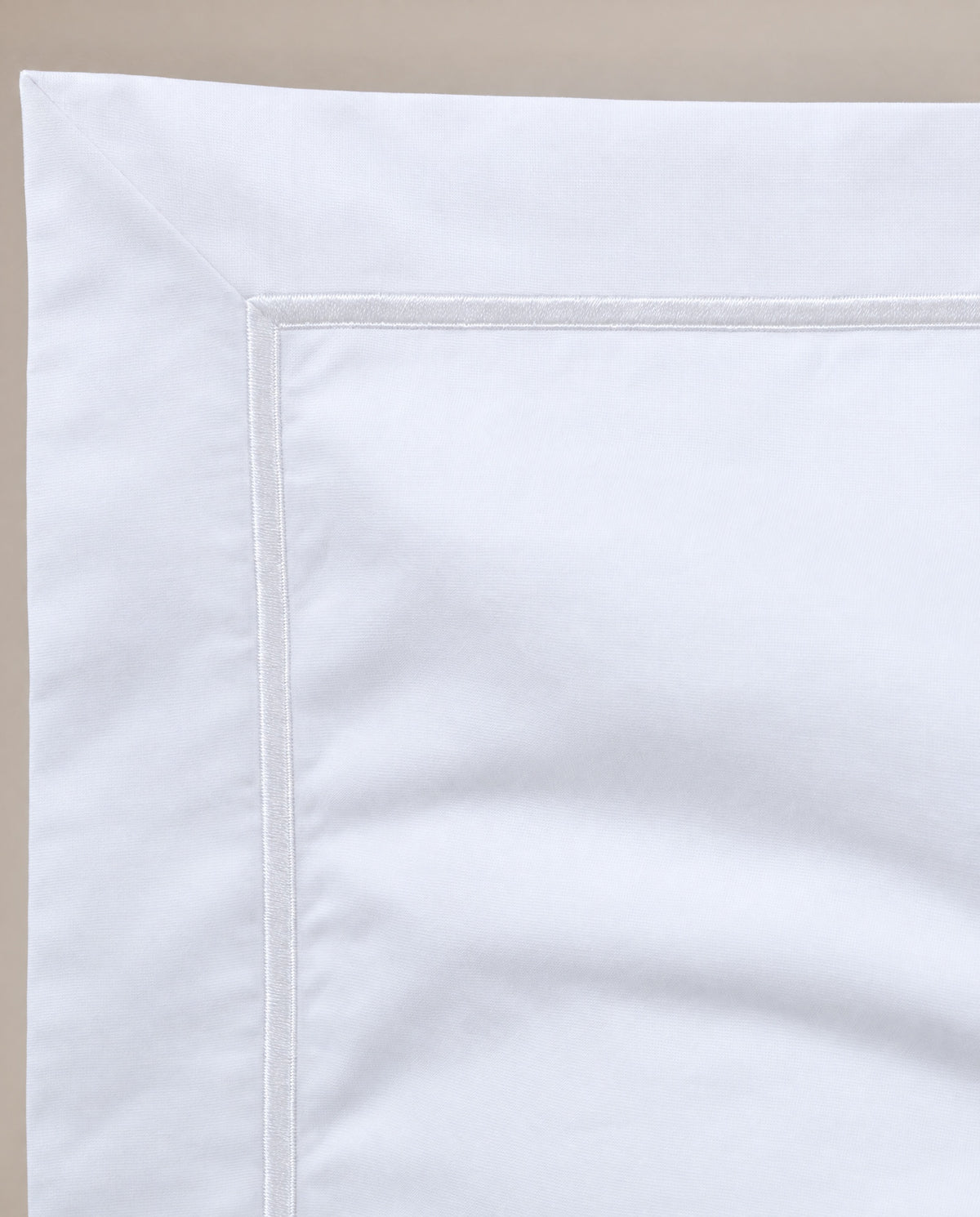The white embroidered edge, up close.